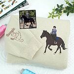 Sand colored crewneck sweatshirt featuring custom embroidered dressage horse and rider with sleeve embroidery name Boogie and dove heart icon