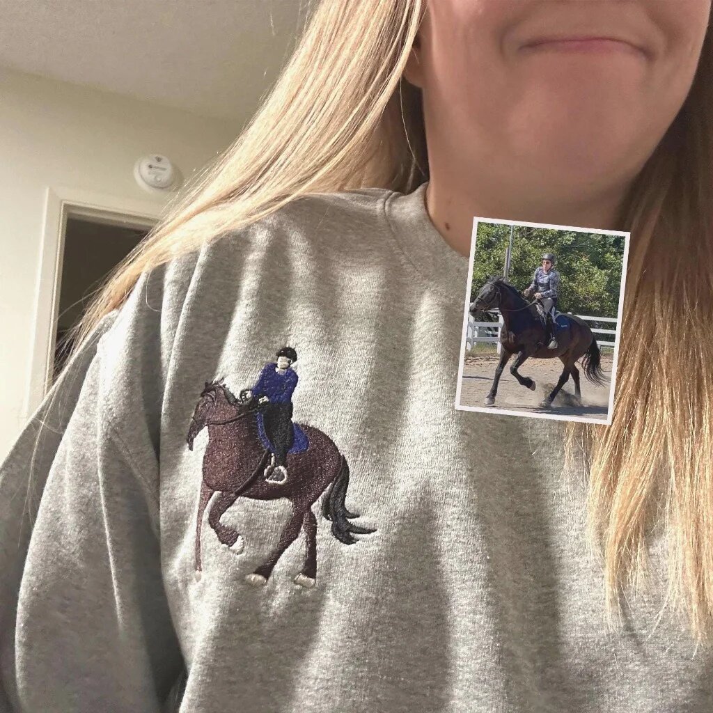 Custom Embroidered Horse Portrait Crewneck Sweatshirt – On Model Fit Woman wearing sport grey crewneck sweatshirt with custom embroidered equestrian rider and horse portrait on right chest with photo comparison