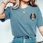 Model wearing a blue jean custom embroidered pet portrait shirt featuring a spaniel dog face and name Ziti