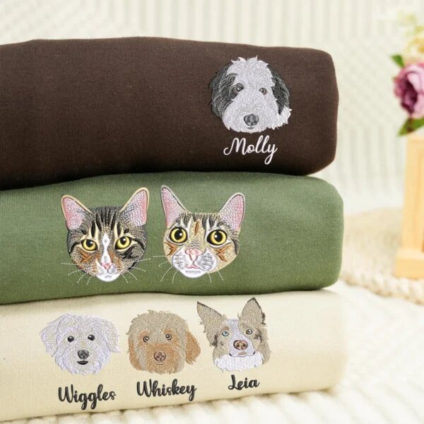 Custom pet portrait embroidered sweatshirts with one, two, and three dog or cat faces and personalized names