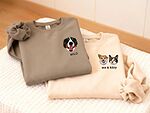 Two custom pet portrait embroidered sweatshirts with one dog and a dog-and-cat pair plus personalized names