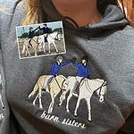 Dark heather grey equestrian hoodie featuring custom embroidered two horse riders high fiving with Barn Sisters text and original photo inset