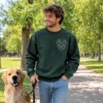 Dog dad walking a Golden Retriever in a forest green custom pet portrait sweatshirt