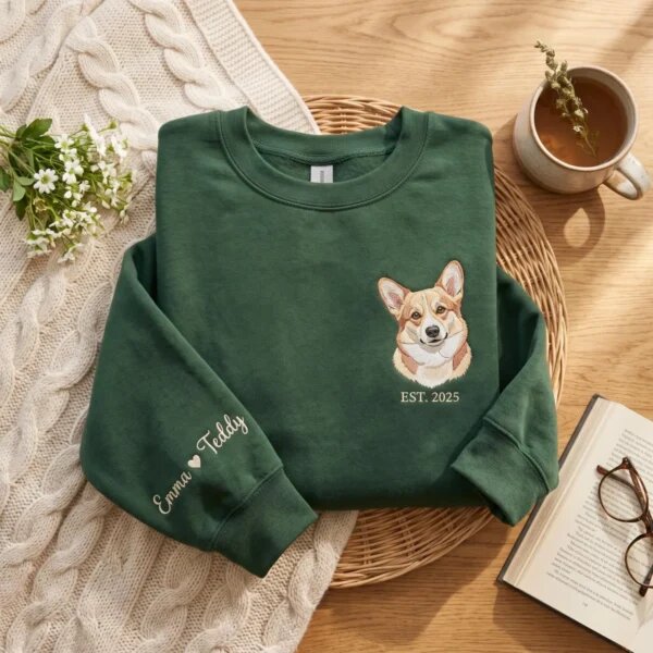 Forest green personalized corgi portrait sweatshirt with embroidered EST. 2025 text and sleeve names