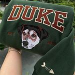 Forest green custom dog portrait varsity sweatshirt embroidered with Duke name, EST. 2023, and fishbone sleeve icon