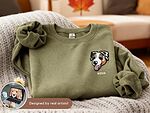 Olive green sweatshirt personalized with Nova name and a custom embroidered dog portrait