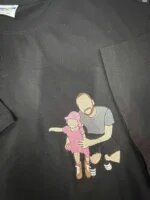 Black custom embroidered t-shirt featuring a kneeling father hugging his young daughter in a pink sunhat and dress digitized from family photo