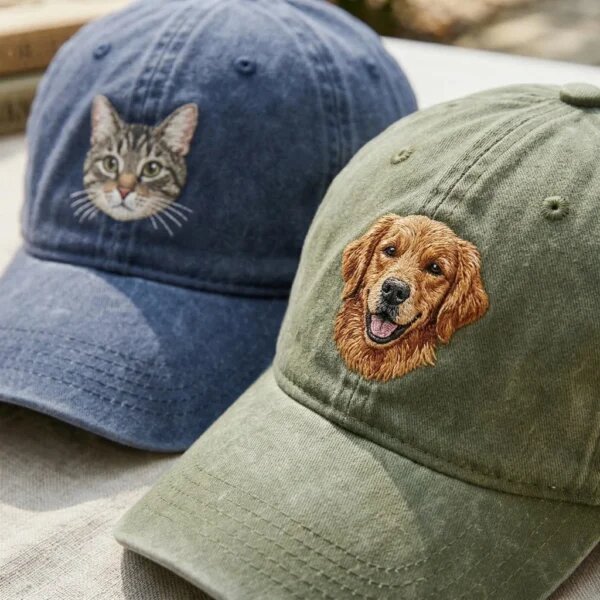 Detailed macro close-up of embroidery stitching showing tabby cat face on blue cap and golden retriever dog face on olive green washed hat