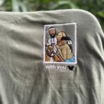 Custom embroidered photo t-shirt featuring an embroidered polaroid portrait of a couple and their dog with custom text with you on olive green fabric