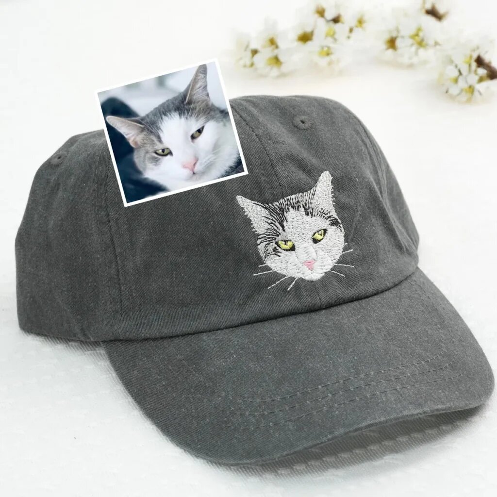 Gray wash cap with an embroidered white and gray cat beside its inset reference photo