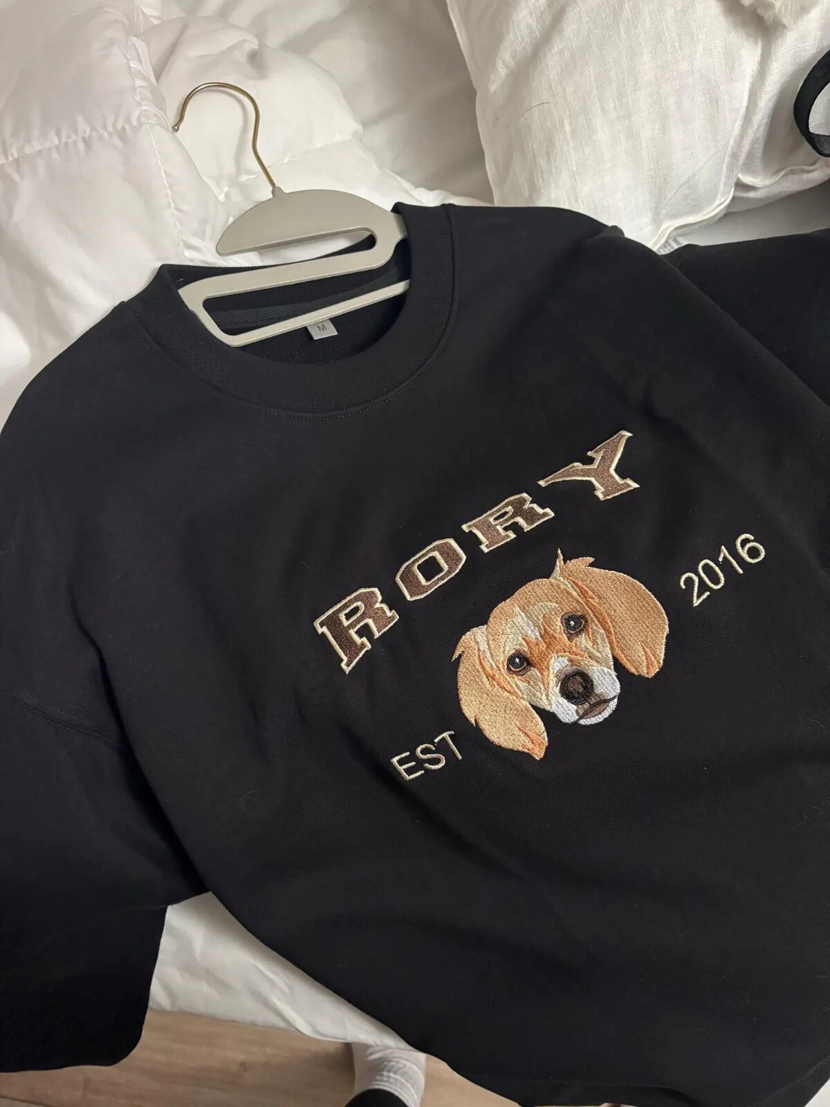 customer feelback and review Black crewneck sweatshirt on a hanger, embroidered with a dog portrait, the name Rory and EST 2016