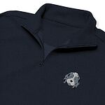 Close-up of a Navy quarter zip collar and chest, embroidered with a blue merle aussiedoodle face with a white blaze and blue eyes on the left chest