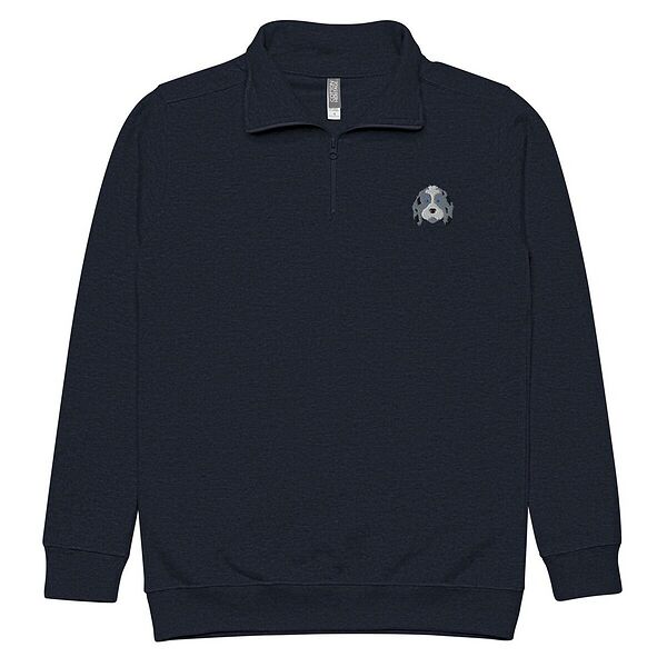 Navy quarter zip pullover on a white background, embroidered with a blue merle aussiedoodle face with a white blaze and blue eyes on the left chest