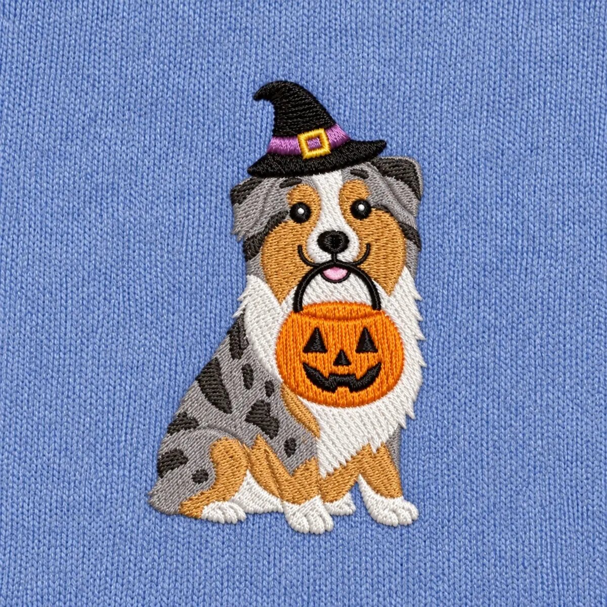 Australian Shepherd Witch Hat Embroidery Close-up Close-up of the embroidered Australian Shepherd in a witch hat with a jack-o'-lantern candy bucket
