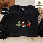 Black crewneck sweatshirt with a brown felt hat and dried bunny tail grass, embroidered with three Bernese mountain dog puppies in a Christmas tree costume, a Santa hat with a red scarf and reindeer antlers with a red sweater