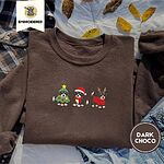 Dark Chocolate crewneck sweatshirt on a plaid flannel shirt with yellow autumn leaves and denim shorts, embroidered with three Bernese mountain dog puppies in a Christmas tree costume, a Santa hat with a red scarf and reindeer antlers with a red sweater