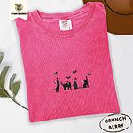 Crunchberry Comfort Colors T-shirt embroidered with four black cat silhouettes in Santa hats reaching for holly across the chest
