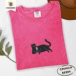 Crunchberry Comfort Colors T-shirt embroidered with a black cat lounging on its side holding a stemmed glass of pink wine
