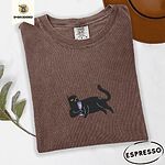 Espresso Comfort Colors T-shirt embroidered with a black cat lounging on its side holding a stemmed glass of pink wine