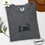 Pepper Comfort Colors T-shirt embroidered with a black cat lounging on its side holding a stemmed glass of pink wine