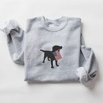 Sport Grey crewneck sweatshirt laid flat with rolled sleeves, a black lab silhouette with an American flag stitched in the center