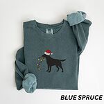 Blue Spruce crewneck sweatshirt laid flat with rolled cuffs, embroidered with a black Labrador in a Santa hat carrying a string of Christmas lights