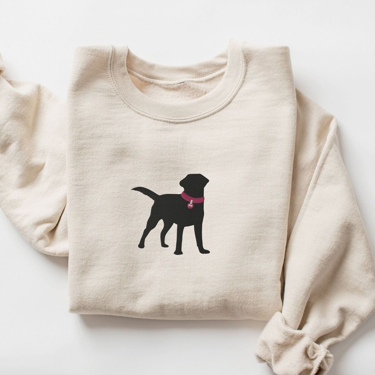 Black Lab Silhouette Sweatshirt - center chest Sand Sand crewneck sweatshirt with a larger black Labrador silhouette in a hot pink collar and tag centered on the chest