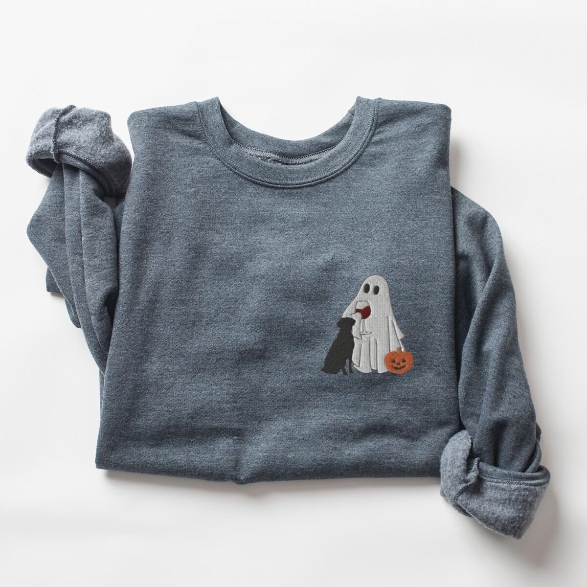 Black Lab Wine Sweatshirt – Dark Heather Dark Heather crewneck sweatshirt laid flat on a white background, embroidered with a small ghost lab mom sipping red wine with a black lab sitting against her and a jack-o'-lantern, on the left chest