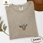 Khaki Comfort Colors T-shirt embroidered with a brown calf head wearing a light blue bandana tied in a bow