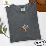 Pepper Comfort Colors T-shirt embroidered with a brown calf head wearing a light blue bandana tied in a bow
