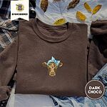Dark Chocolate crewneck sweatshirt on a plaid flannel shirt with yellow autumn leaves and denim shorts, embroidered with a brown calf head wearing a light blue bandana tied in a bow