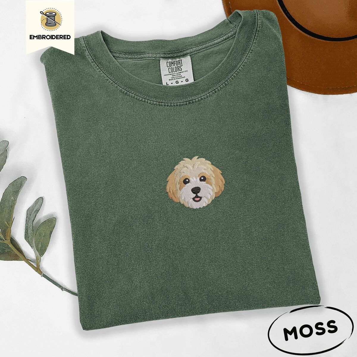 Cavachon Shirt – Moss Moss Comfort Colors T-shirt embroidered with a mini Cavachon face in cream and apricot with a white muzzle