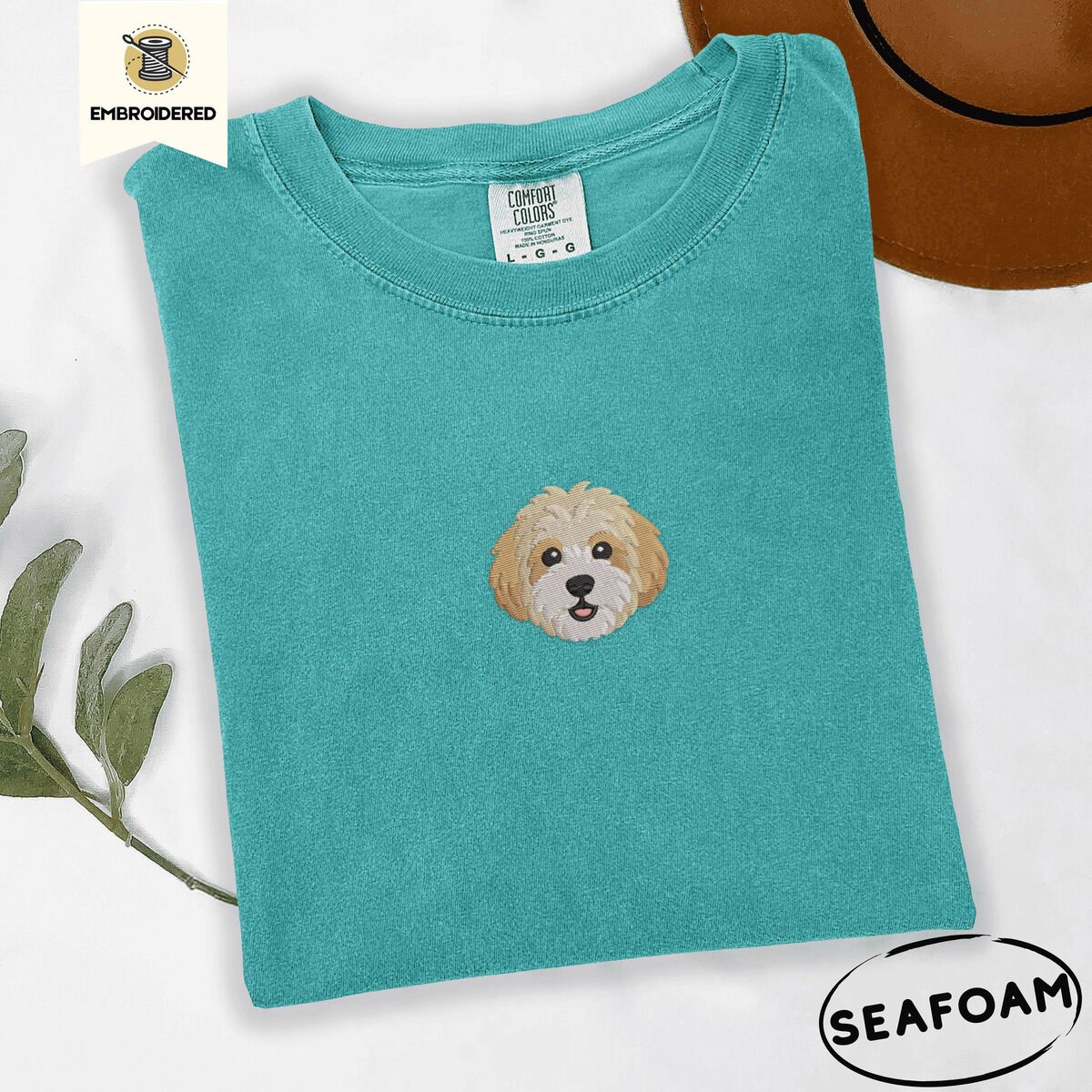 Cavachon Shirt – Seafoam Seafoam Comfort Colors T-shirt embroidered with a mini Cavachon face in cream and apricot with a white muzzle