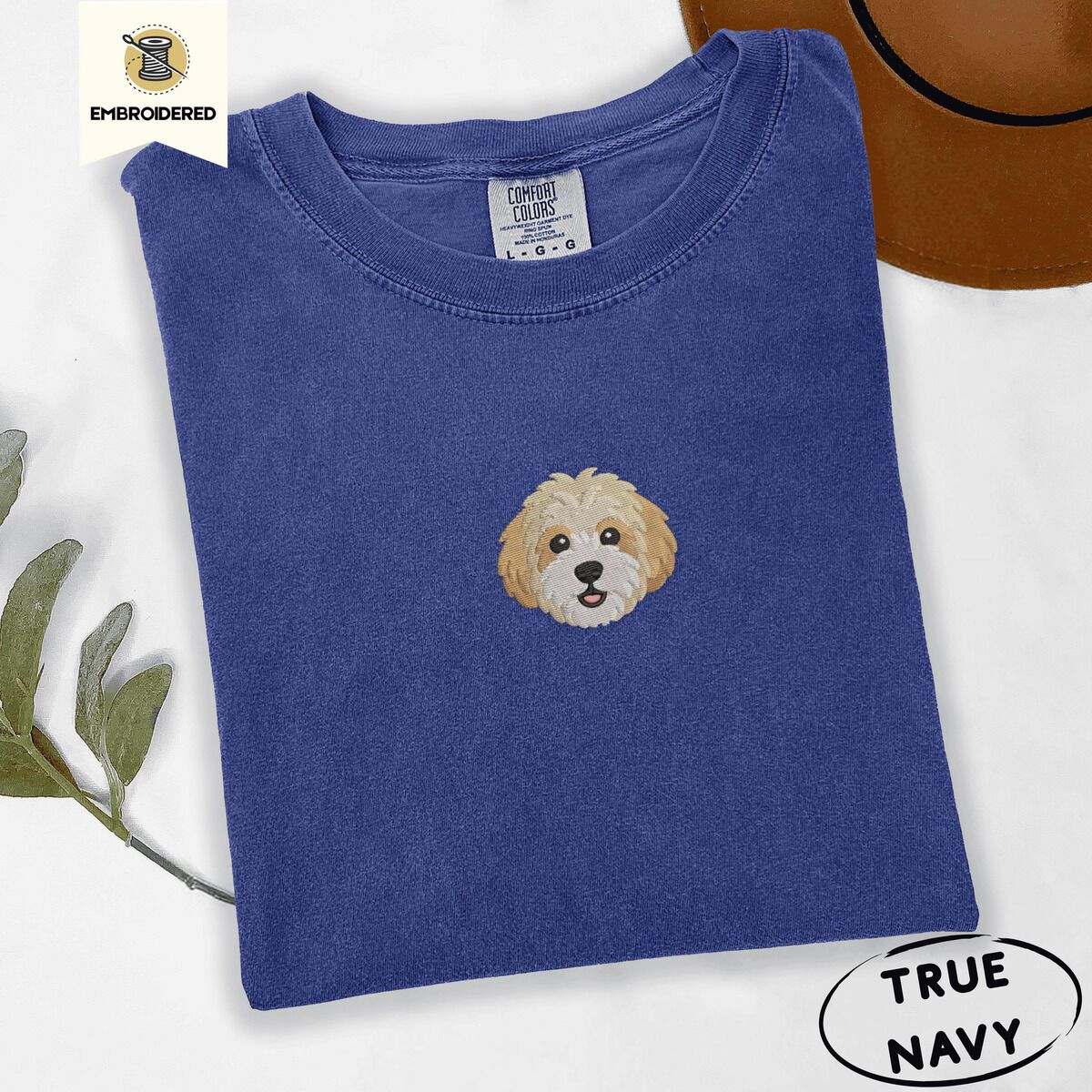 Cavachon Shirt – True Navy True Navy Comfort Colors T-shirt embroidered with a mini Cavachon face in cream and apricot with a white muzzle