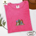 Crunchberry Comfort Colors T-shirt embroidered with two Blenheim Cavalier King Charles Spaniels in knit beanies beside a little lit Christmas tree