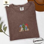 Espresso Comfort Colors T-shirt embroidered with two Blenheim Cavalier King Charles Spaniels in knit beanies beside a little lit Christmas tree
