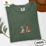Moss Comfort Colors T-shirt embroidered with two Blenheim Cavalier King Charles Spaniels in knit beanies beside a little lit Christmas tree