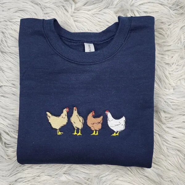 Navy chicken crewneck with four embroidered farm hens with yellow feet and red combs