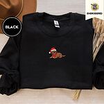 Black crewneck sweatshirt with a brown felt hat and dried bunny tail grass, embroidered with a chocolate lab puppy in a Santa hat and red scarf in the center of the chest