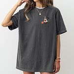 Woman in an oversized Pepper T-shirt embroidered with a small chocolate lab in a ghost sheet on the left chest