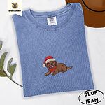 Blue Jean Comfort Colors T-shirt embroidered with a chocolate Labrador puppy lying down in a red Santa hat and a red knit scarf