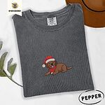 Pepper Comfort Colors T-shirt embroidered with a chocolate Labrador puppy lying down in a red Santa hat and a red knit scarf