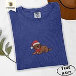 True Navy Comfort Colors T-shirt embroidered with a chocolate Labrador puppy lying down in a red Santa hat and a red knit scarf