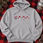 Sport grey hoodie with the four embroidered Santa cows across the chest on a buffalo plaid blanket