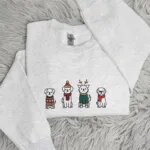 Light heather grey Christmas dog sweatshirt with four embroidered puppies in Christmas sweaters, scarves and antlers