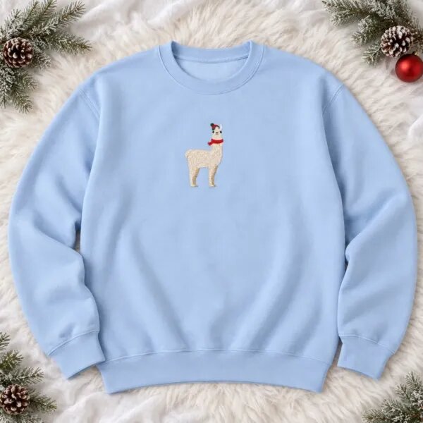 Light blue Christmas llama crewneck laid flat with the small embroidered llama centered on the chest, pine sprigs and pine cones