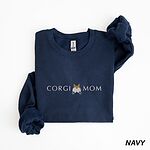 Navy crewneck sweatshirt laid flat on white, embroidered with CORGI MOM and a fluffy corgi butt with pointed ears