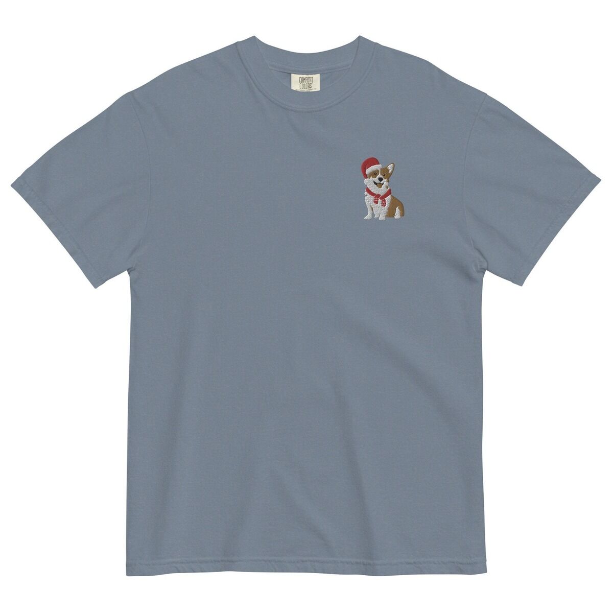 Corgi Santa Hat Shirt – Blue Jean Blue Jean T-shirt laid flat on a white background, embroidered with a smiling red and white Pembroke corgi in a Santa hat and striped red scarf on the left chest