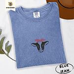 Blue Jean Comfort Colors T-shirt embroidered with a black and white cow head wearing a pink heart bandana tied in a bow