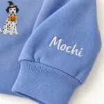 Custom Dalmatian sweatshirt with the dog name Mochi embroidered on the sleeve